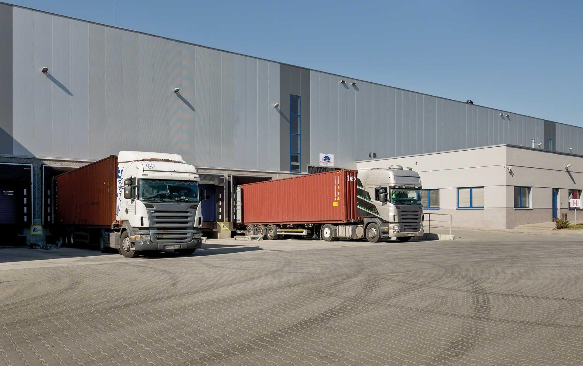 Trucks loading and unloading goods at the warehouse docks